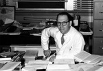 Batson at his desk, front view, 1950s by Blair E. Batson and University of Mississippi. Medical Center