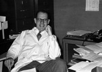 Batson leaning back in office chair, 1950s by Blair E. Batson and University of Mississippi. Medical Center
