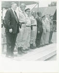 Men standing at attention. Left to right: Governor Ross Barnett; General Logan; Adj. General W.P. Wilson; Clayton; Lieutenant Governor Paul B. Johnson Jr; and three unknown men. by Author Unknown