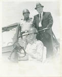 General Claude F. Clayton standing in jeep with Governor Ross Barnett. by Author Unknown