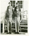 Claude F. Clayton with three unidentified men in military uniform. by U.S. Army Signal Corps