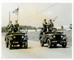 Military Jeeps with American flags by Author Unknown