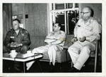 General Clayton sitting with General Wilson and unidentified man. by Author Unknown