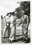 General Clayton with two unidentified men. by Author Unknown