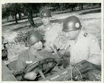 Claude F. Clayton with Will Lewis and a soldier named Kent during military exercise. by Author Unknown