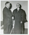 Claude F. Clayton shaking hands with Judge Allen Cox. by Author Unknown