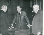 Claude F. Clayton shaking hands with Senator John C. Stennis and standing next to Senator James O. Eastland. by Author Unknown