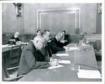Claude F. Clayton seated at table with Senator James O. Eastland and Senator John C. Stennis. by Author Unknown