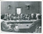 Claude F. Clayton seated at table with Senator James O. Eastland and Senator John C. Stennis. by Author Unknown