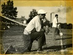 Man on sidelines of a football game by J. R. Cofield
