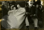 Couple under a blanket at a game, image 1 by J. R. Cofield