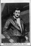 William Faulkner in flight jacket and silk scarf by Unknown
