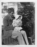 William Faulkner with baby daughter Jill on his lap on the steps of Rowan Oak by Unknown