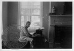 William Faulkner seated at typewriter inside Rowan Oak by Dan Brennan
