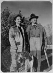 William Faulkner and daughter Jill in hunting clothes, with gun, dead duck, and dog. Charlottesville, Virginia by Unknown