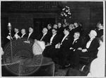William Faulkner and Bertrand Russell at the Nobel Prize ceremony, seated with other prize winners by Unknown