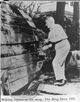 William Faulkner repairing the hull of his boat, the Ring Dove by Unknown