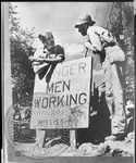 John Faulkner leaning on WPA sign: Danger men working by Unknown