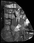 John Faulkner holding his novel Chooky by Unknown