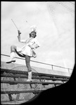 Ole Miss marching band majorette in the bleachers by J. R. Cofield