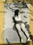 Woman sunbathing by J. R. Cofield