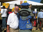 Man Standing Next to Person in Fish Costume in Grove by Bill Kingery