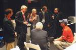 Chancellor Khayat with group of people backstage at the Ford Center during the 2008 Presidential Debate at the University of Mississippi by Author Unknown