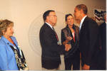 Barack Obama with unidentified people backstage at the Ford Center during the 2008 Presidential Debate at the University of Mississippi by Author Unknown
