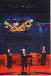 Chancellor Robert Khayat and two unidentified men on Ford Center stage during the 2008 Presidential Debate at the University of Mississippi by Author Unknown