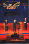 Chancellor Robert Khayat and two unidentified men on Ford Center stage during the 2008 Presidential Debate at the University of Mississippi; 2 copies by Author Unknown
