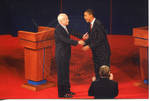John McCain and Barack Obama shaking hands on stage at the Ford Center during the 2008 Presidential Debate at the University of Mississippi by Author Unknown