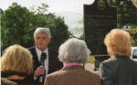 Chancellor Robert Khayat addresses unidentified guests at the dedication of the 2008 Presidential debate plaque at the University of Mississippi; 3 copies by Author Unknown
