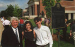 Chancellor Robert Khayat with unidentified man and woman in front of 2008 Presidential debate plaque at the University of Mississippi; 2 copies, image 001 by Author Unknown