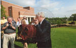 Chancellor Robert Khayat, Thomas "Sparky" Reardon, and guests in front of the Ford Center at the University of Mississippi, image 001 by Author Unknown