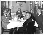 Felton M. Johnston, William Wannall, Dorothye Scott, and others at dinner. by Author Unknown