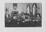 Members of Congress at a conference table. by Harris & Ewing