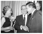 Felton and Wanda Johnston with unidentified man at a function. by Author Unknown