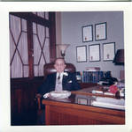 Felton M. Johnston sitting behind desk. by Author Unknown