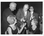 Felton M. Johnston and others shaking hands at an event. by Author Unknown