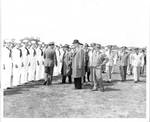 Members of Congress and Naval officers inspecting sailors. by United States. Department of the Navy