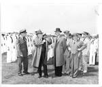 Vice President Alben W. Barkley, Naval officers, and members of Congress inspect sailors. by United States. Department of the Navy