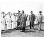 Naval officers and members of Congress inspect sailors. by Norfolk Virginian Pilot