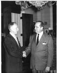 Felton M. Johnston shaking hands with unidentified man. by Author Unknown