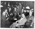 Felton M. Johnston and others at a table. by Hessler