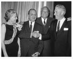 Felton M. Johnston with Wanda Johnston and two unidentified men. by Author Unknown