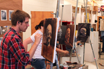 Students paint in class by Photographer Unknown