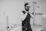 Nick Meyer adjusts his tie by Nicholas Meyer