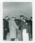 Two men shaking hands among military personnel by Standard Photo Co. (Jackson, Miss.)