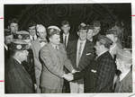 Carroll Gartin shaking hands with unidentified men by Author Unknown