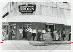 Carroll Gartin speaking outside of Tindall Polk Drugs by Author Unknown